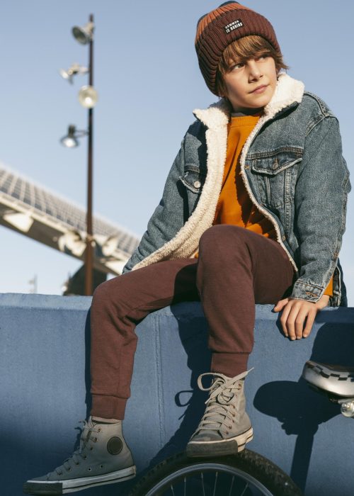 little kid with bike outdoors scaled.jpg